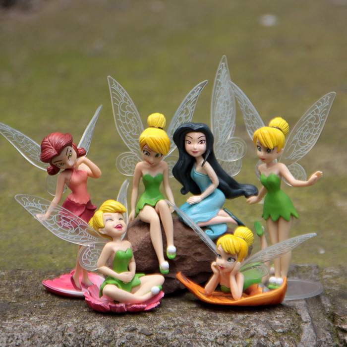 Tinker Bell and fairy friends collectible figurine set displayed outdoors