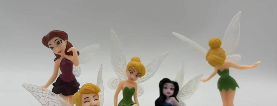 Tinker Bell and fairy friends figurine collection arranged for display