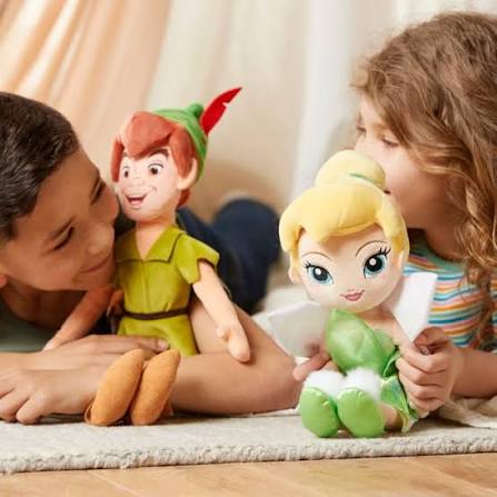 Children playing with Tinker Bell and Peter Pan plush toys